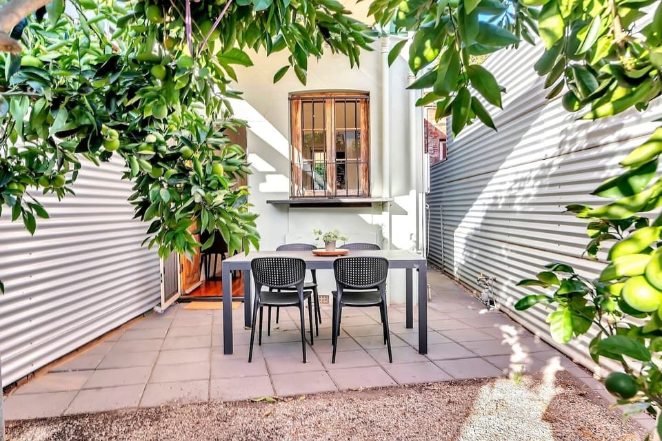 Enjoy a fresh breeze while sitting at the four-seater outdoor dining set. 
