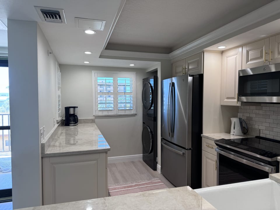 Kitchen with washer and dryer