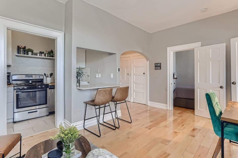 The arched doorway and bar pocket off the kitchen complements the buildings historic charm