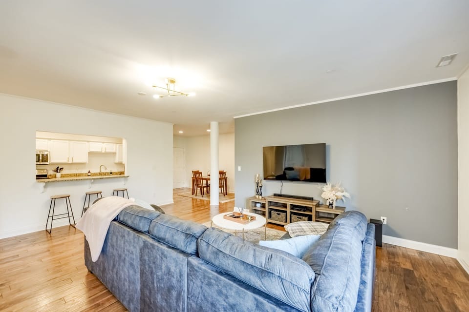 Full view of the living room showcasing the open-plan layout that extends into the dining area—ideal for entertaining.
