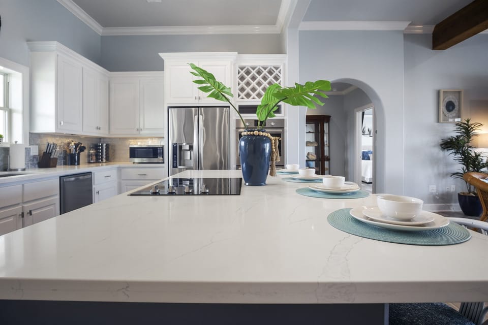 The Paradise Palms Kitchen: Delight in the seamless blend of form and function in this designer kitchen, featuring custom cabinetry, integrated storage solutions, and a built-in wine rack for effortless entertaining.