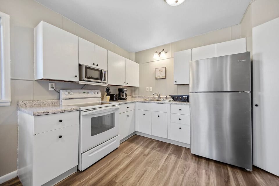 Fully stocked kitchen equipped with top-of-the-line appliances, premium cookware, and an abundance of fresh ingredients awaits to fulfill every culinary desire.