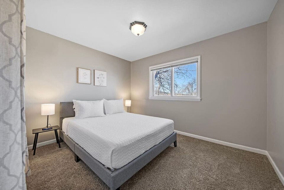 Indulge in nightly luxury with a queen bed adorned with premium sheets and plush pillows, offering a sumptuous retreat for restorative slumber and dream-filled nights.
