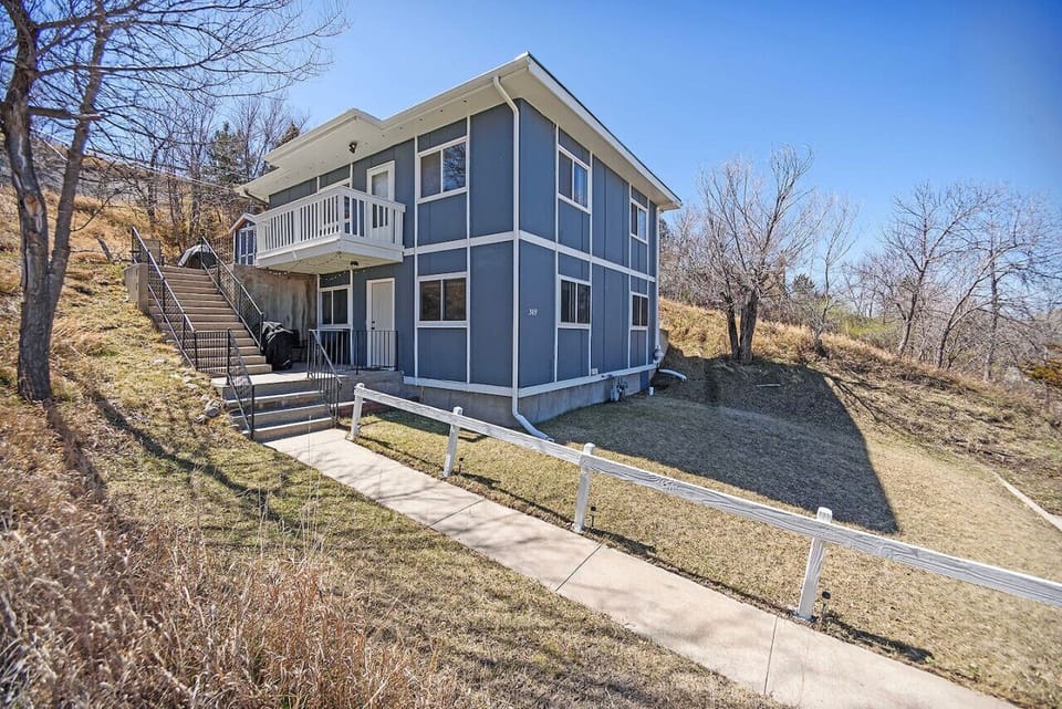 Lower unit duplex offering ample space for comfortable living and entertaining, ideal for those seeking roomy and versatile accommodations.