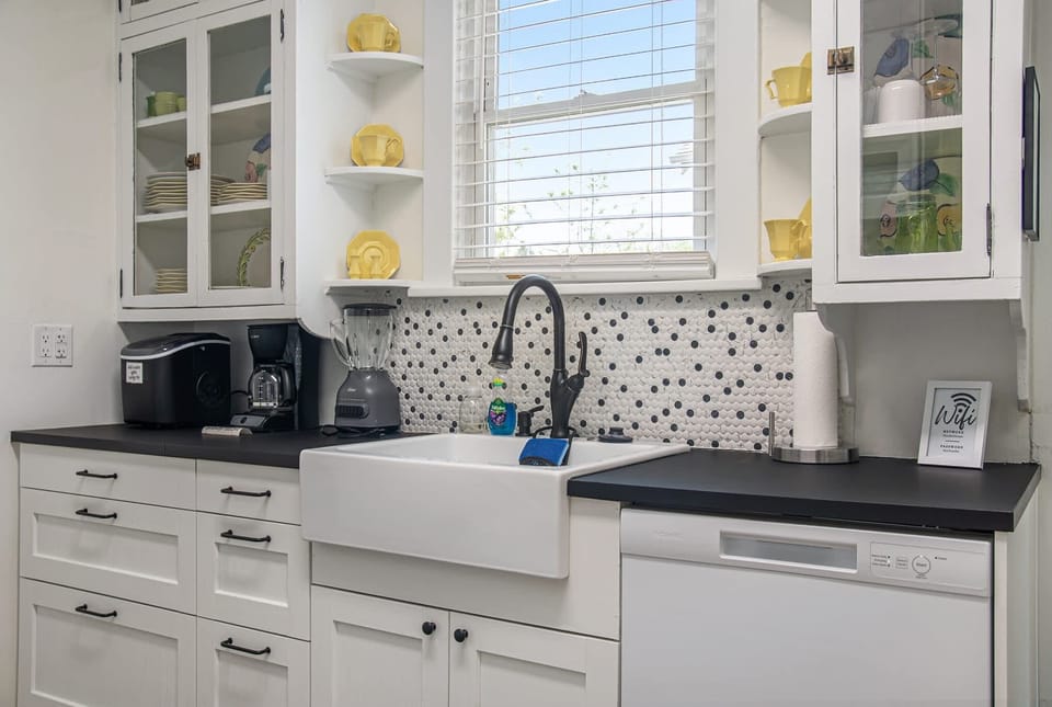 Fully stocked kitchen with all the essentials—coffee maker, cookware, blender, and more—perfect for cooking and dining together!