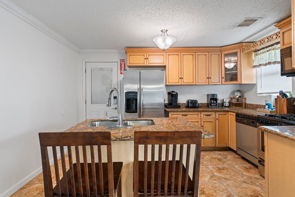 Additional seats at the kitchen island.