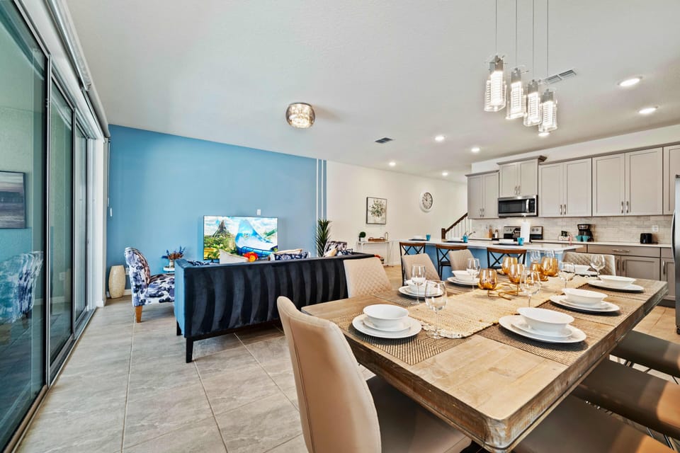 Regal Living Area of the Townhouse in Kissimmee Florida - Cozy seating area conducive to relaxation and socializing - Open layout seamlessly connecting the dining area to the kitchen and living area - Smart TV and Netflix