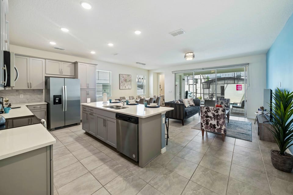 Elegant Living Area of the Townhouse in Kissimmee Florida - Seamless connection to the kitchen for convenience - Harmonious color scheme with pops of accent colors for visual interest