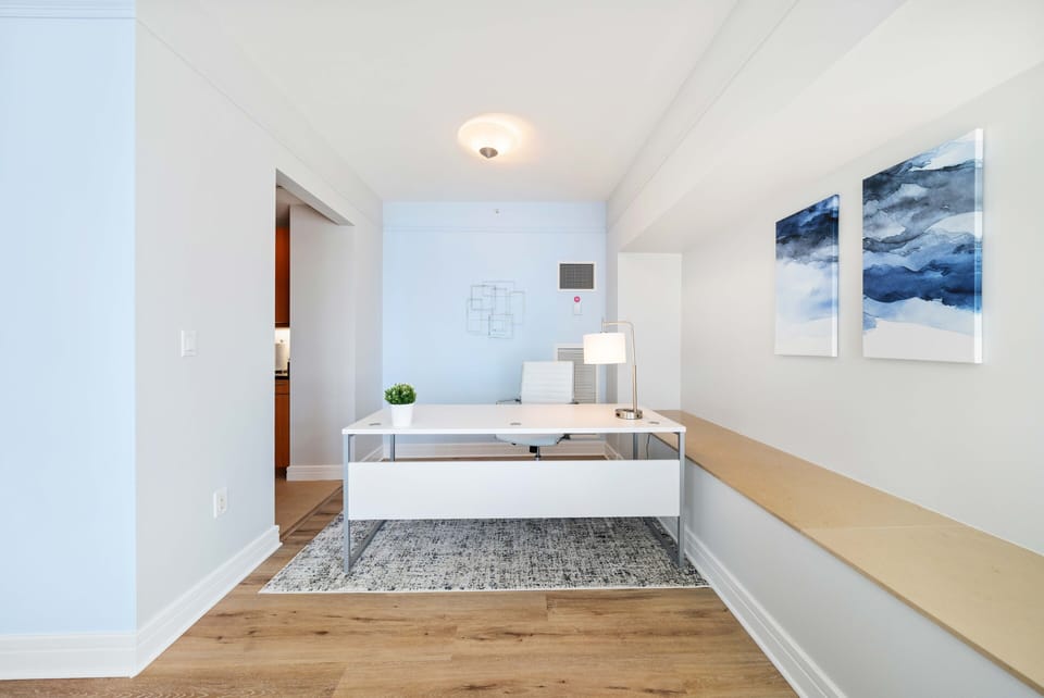 Calming Work space of the Condo in Miami Florida - Sleek, modern furniture and minimalist design for a clean aesthetic - Setting designed to inspire creativity and productivity