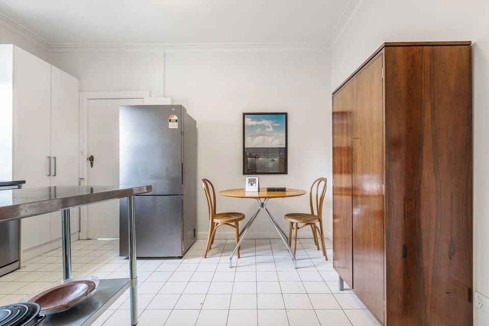  There is an additional two-seater wooden and rattan table setting in the kitchen for easy and casual dining. 
