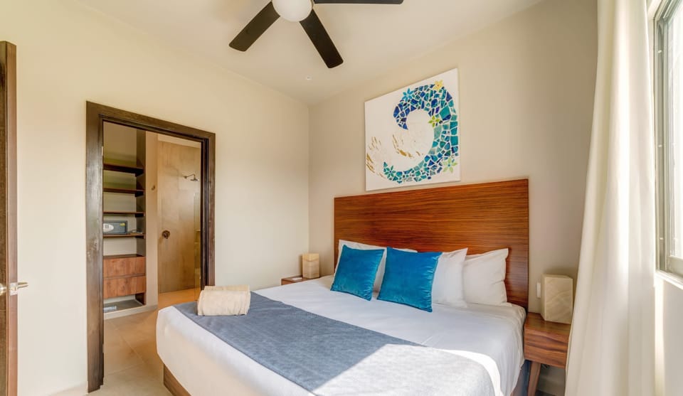 Bedroom 1 features an ensuite bathroom and ample closet space.