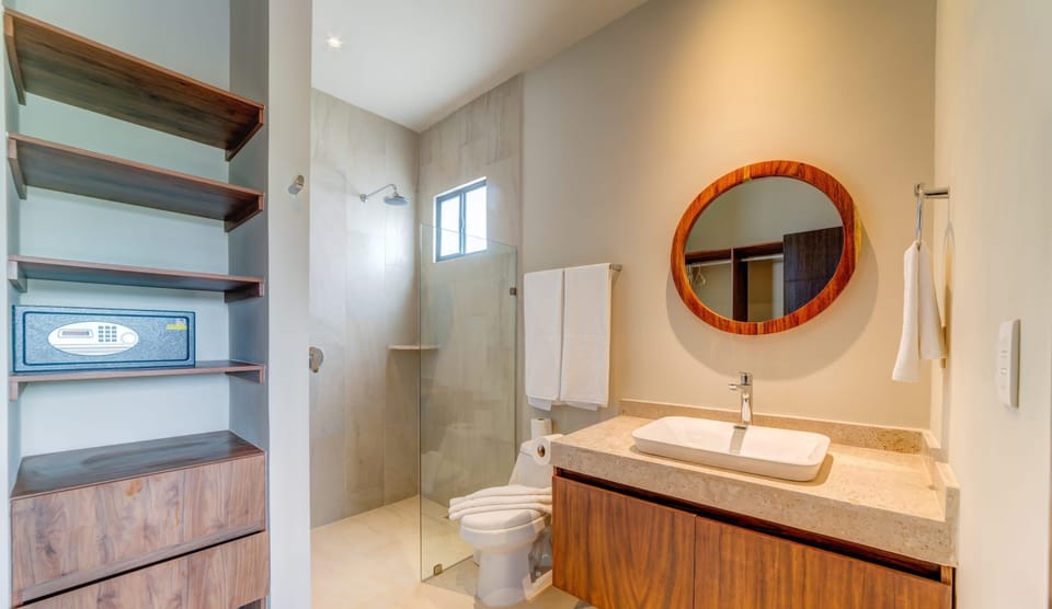 Bathroom 1 with a safe box in the closet for your valuables.