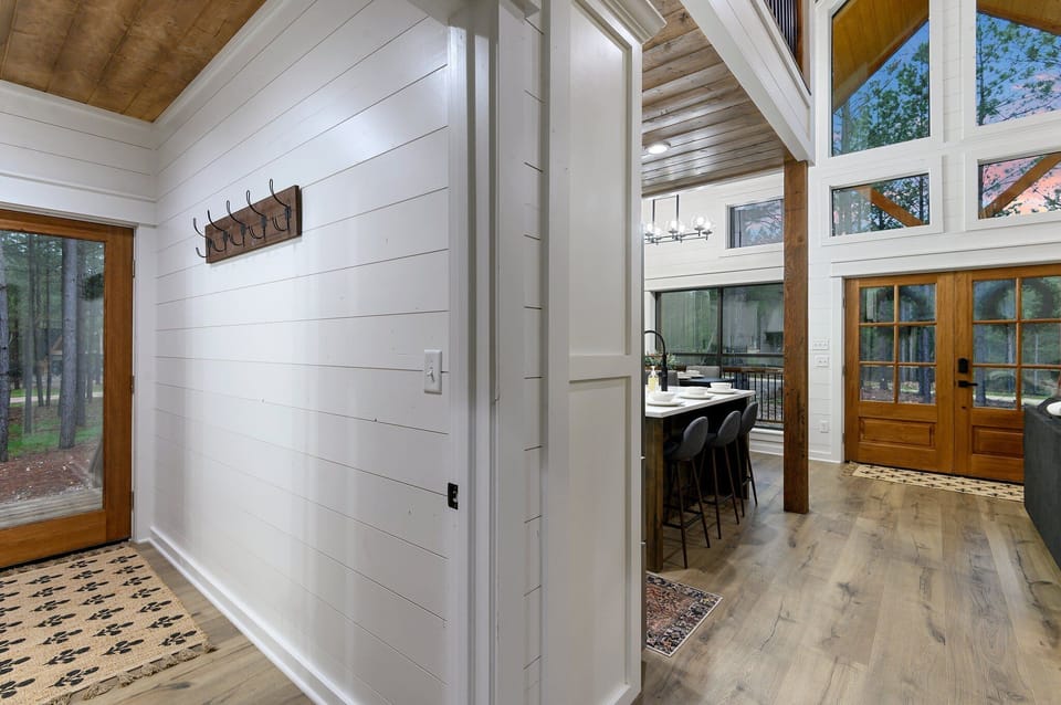 Right off the kitchen is a foyer with access to a half bath and the laundry room, as well as an additional side entry door.