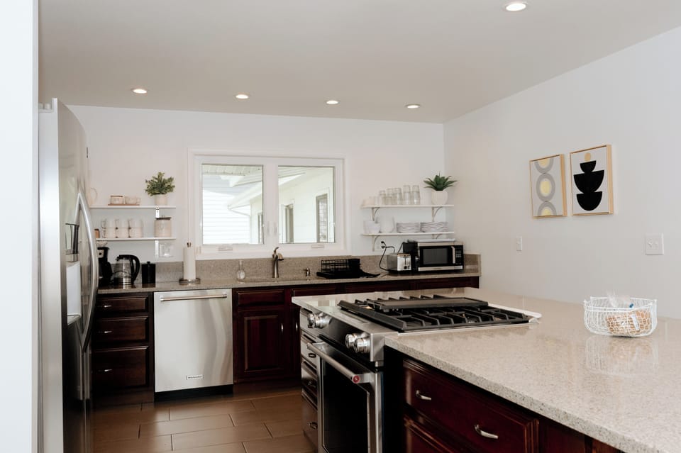 Well equipped kitchen with large island with 4 bar stools.