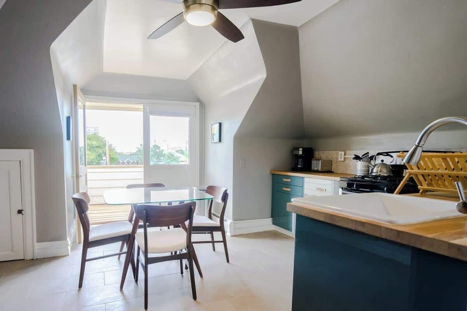 Recently renovated kitchen complemented by the high ceilings and quick access to balcony