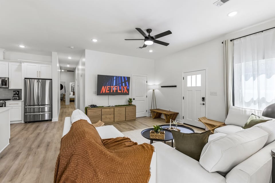 After the beach, pile onto the couch for a movie on the 65" smart TV. No one has to move for hours — that's the rule.