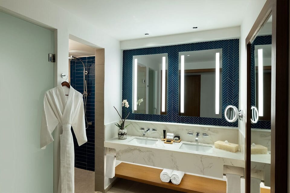 Refresh in a spa-like bathroom with double vanity glow.