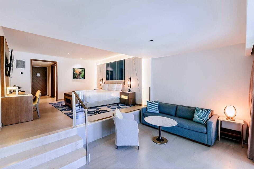 Stretch out in your spacious suite with a cozy lounge corner.
