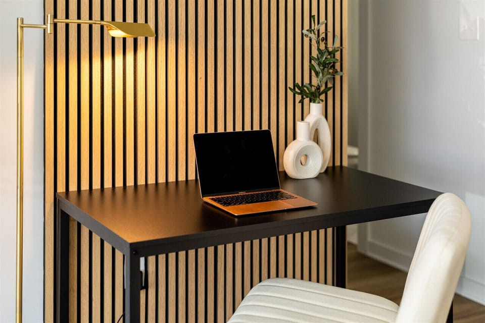 Workstation with architectural desk lamp, oversized desk and chair