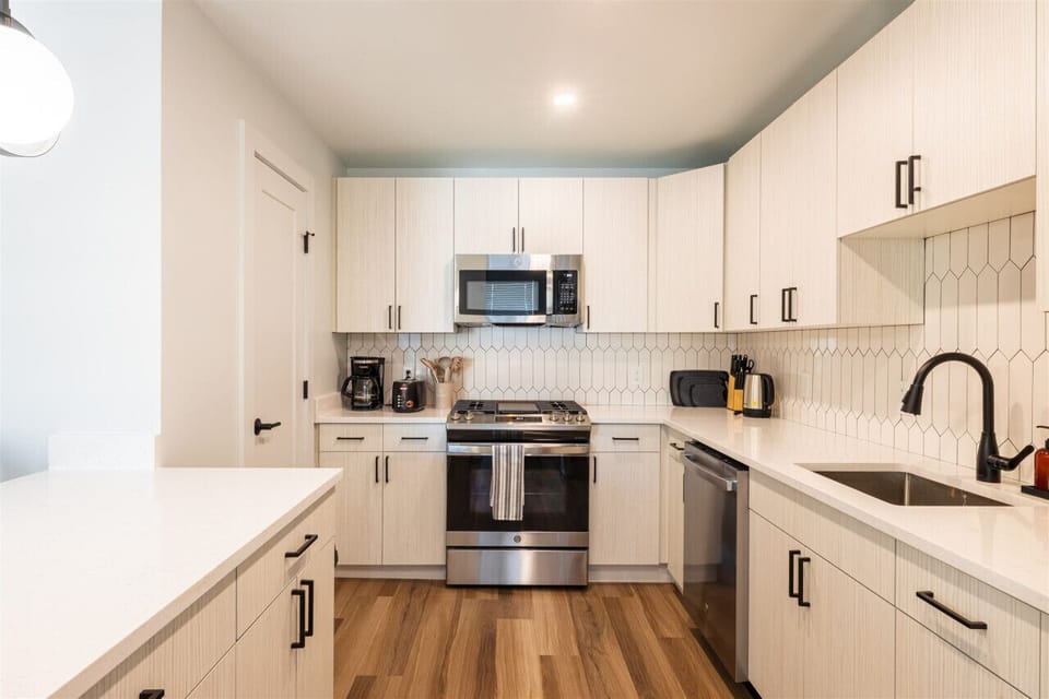 Enjoy cooking in this modern kitchen, complete with everything from cookware to a coffee maker, so you can feel right at home.