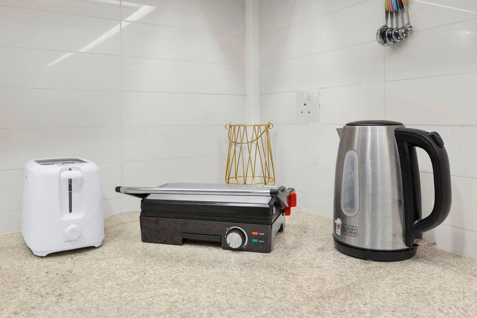 Kitchen Delight: Modern appliances await your culinary adventures in this stylish setup!