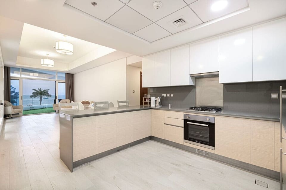 Kitchen: Enjoy stylish cooking space with modern appliances and stunning sea views!