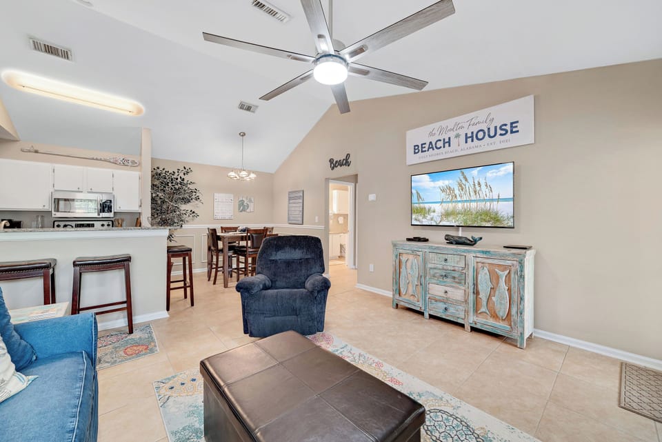 The living, dining, and kitchen areas blend together seamlessly to provide a comfortable transition from room to room.