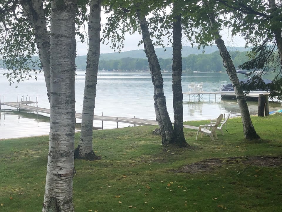 EXTERIOR:  The large and private lakefront backyard