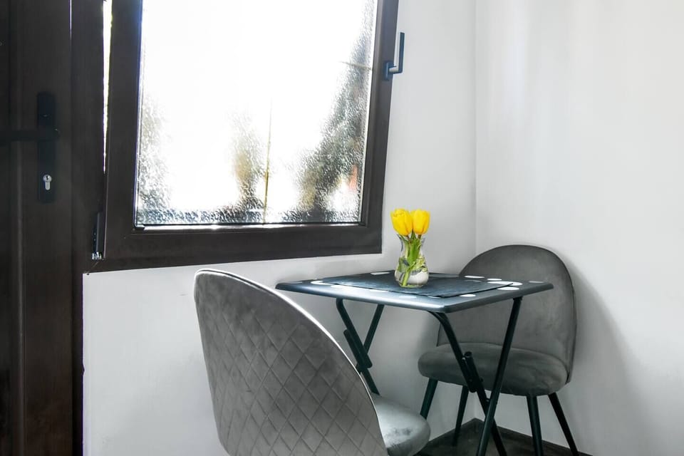 Chic dining spot for two, perfect for a morning coffee.
