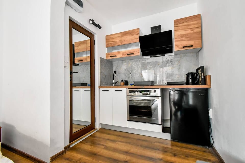 Streamlined kitchenette with a touch of modern charm
