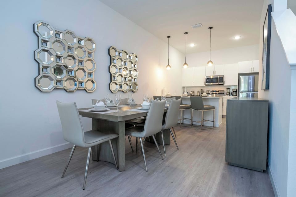 Gather around the table and enjoy meals in a warm, inviting space perfect for conversation and connection.