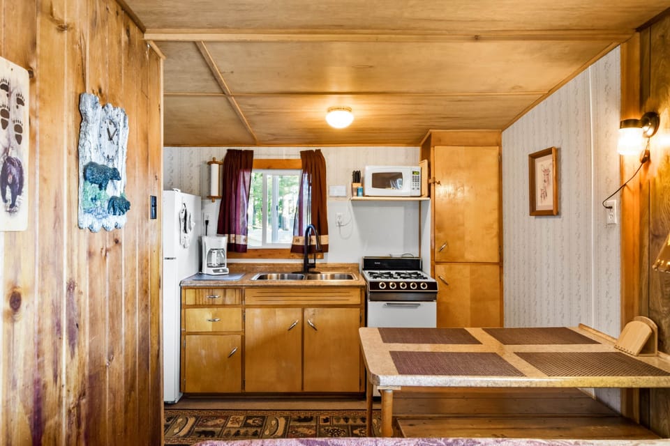 Fully stocked kitchen and dining table.