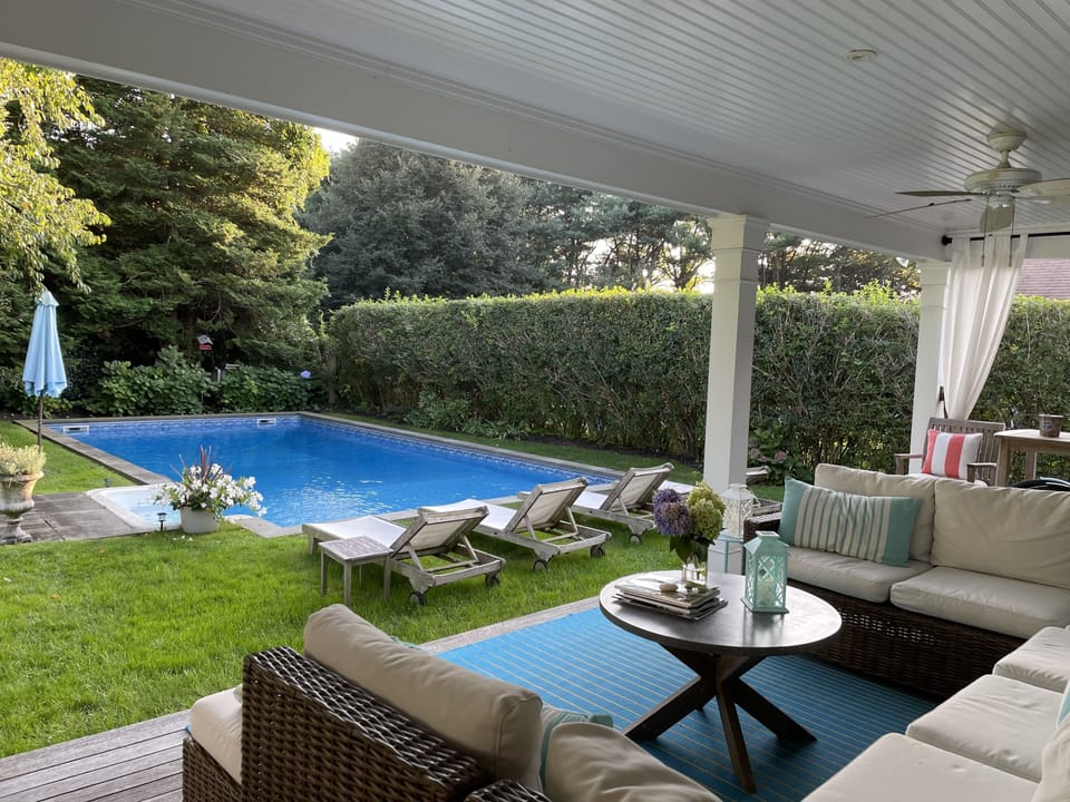 Teak chaise poolside 