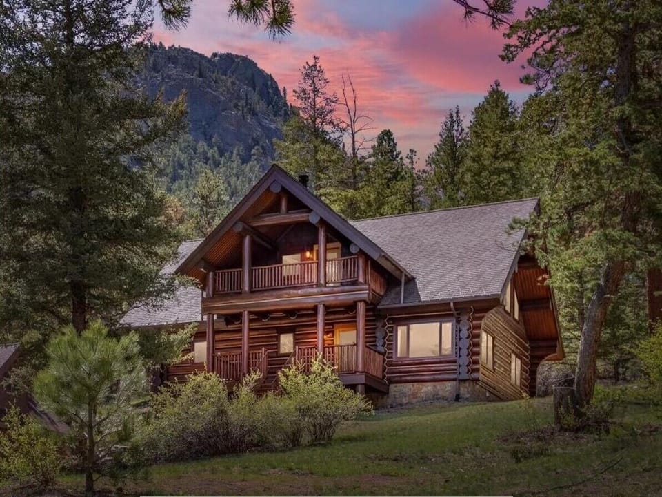 This is not photoshopped! Mountains in front and behind this custom log home.