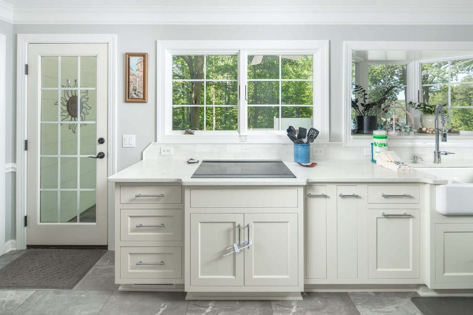 Bright kitchen with large windows and plenty of workspace