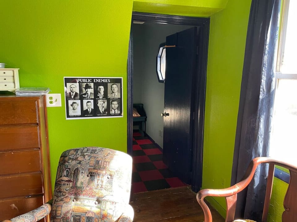 Walk through the main bedroom to get to the small room with extra bed