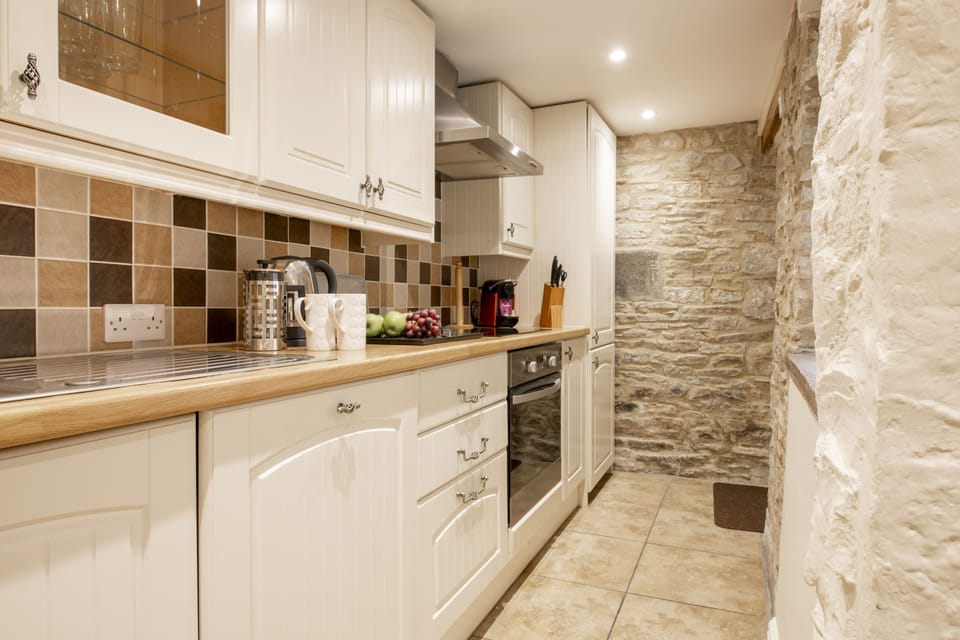 Ground floor: Cottage kitchen with exposed Yorkshire stonework