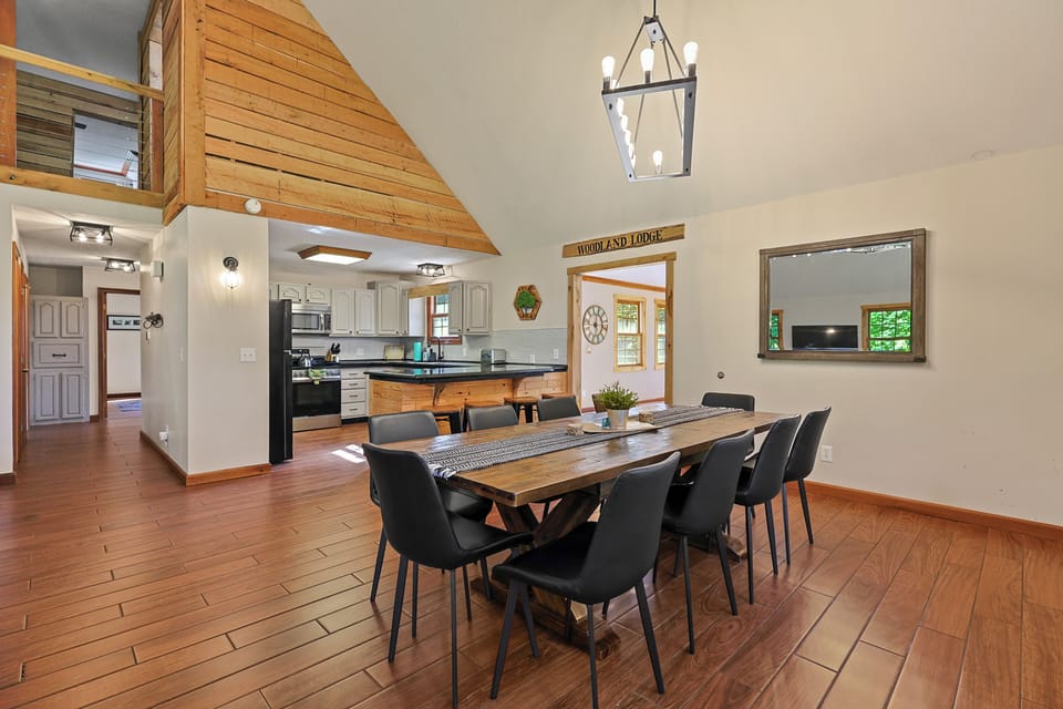 Gather around the spacious dining table with seating for large groups, perfect for family meals, game nights, and celebrations.