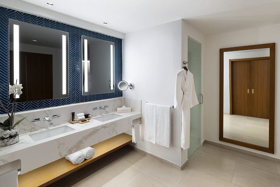 Get ready with double sinks, bright lighting, and luxe finishes.