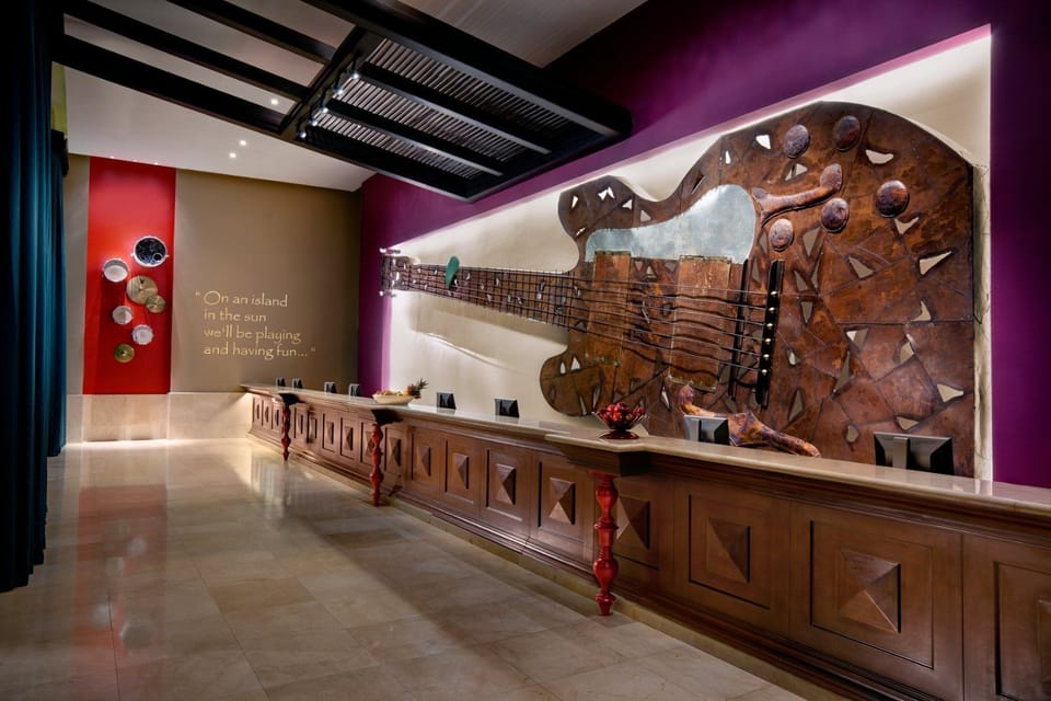 Check in smoothly at an art-filled reception with warm lighting.