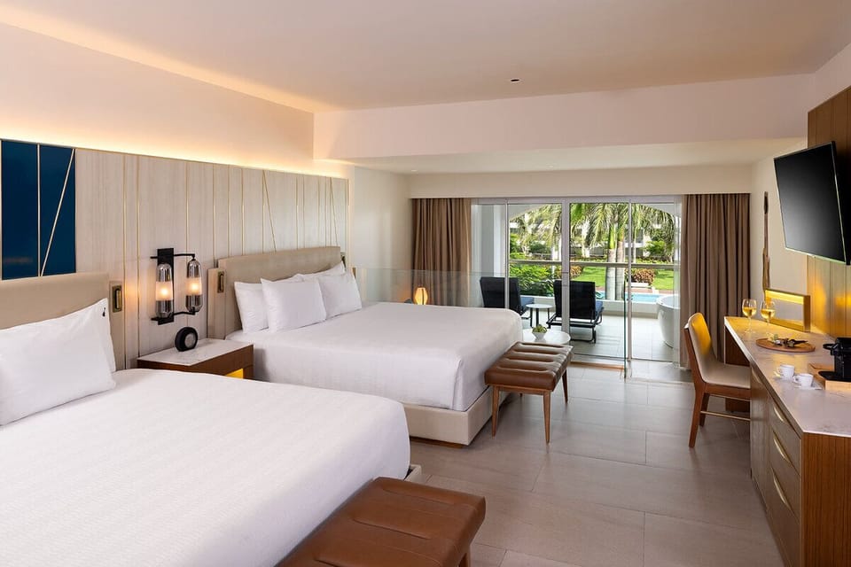 Sip sunset drinks beside your private tub on the balcony.