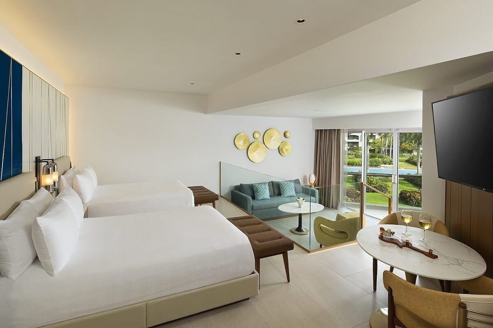 Settle into a sunlit suite with lounge seating and views.