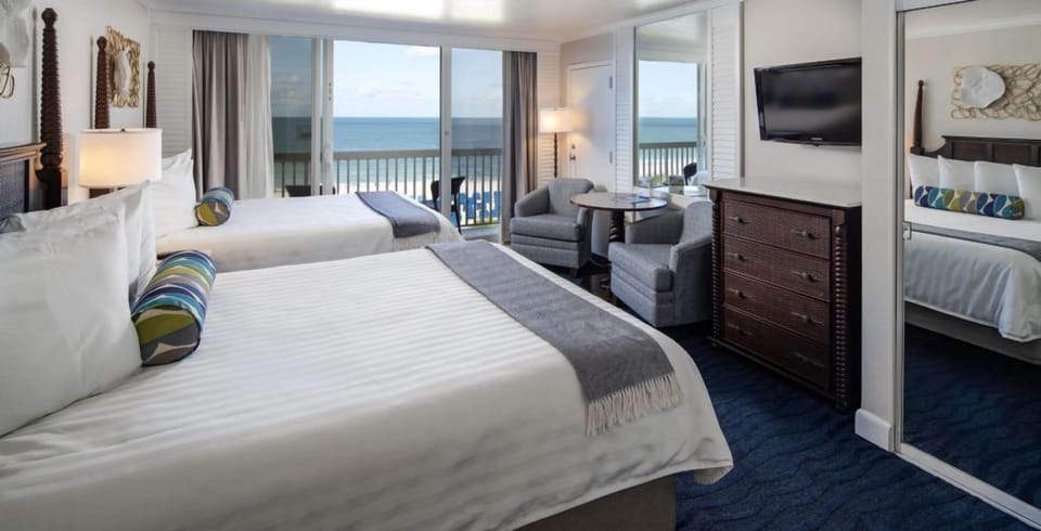 Sip morning coffee while waves shimmer beyond the balcony.