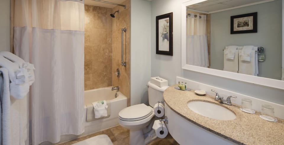 Enjoy an easy morning routine with wide counter space and mirror.