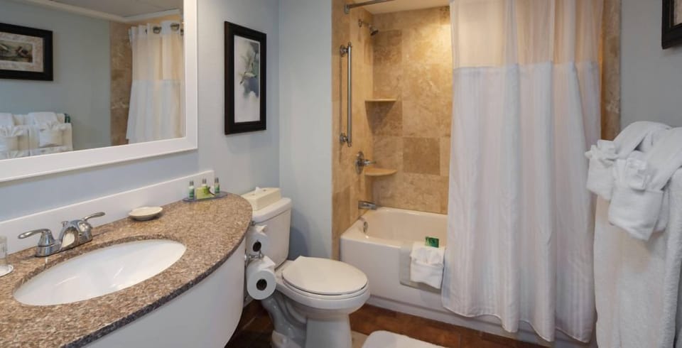 Refresh comfortably with bright vanity space and shower-tub combo.