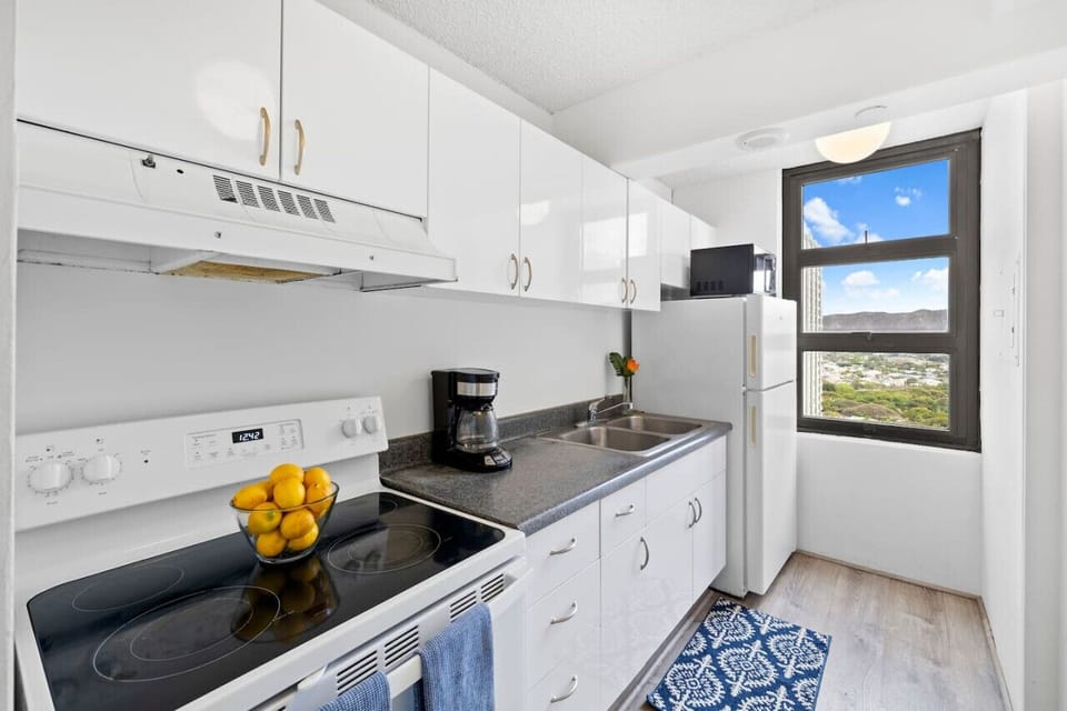 Fully equipped kitchen with oven, microwave, coffee maker