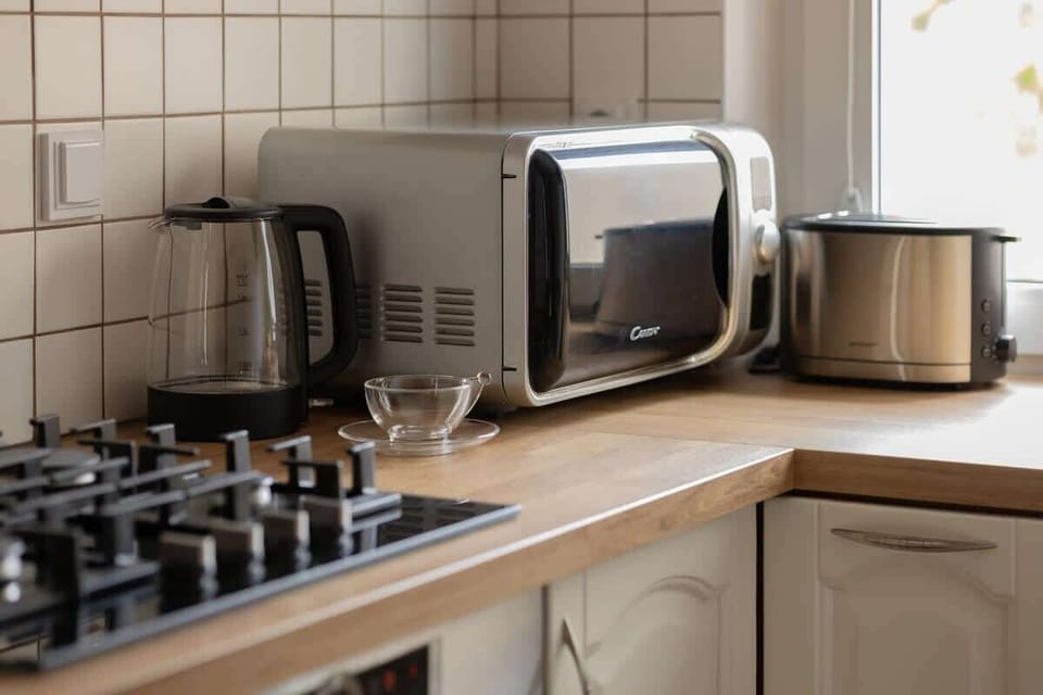 Modern appliances including toaster, kettle, and gas stove for your convenience.

