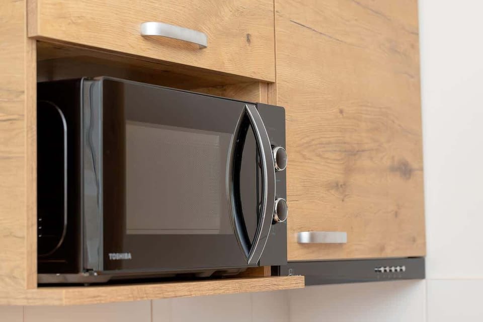 Kitchenette with a microwave.