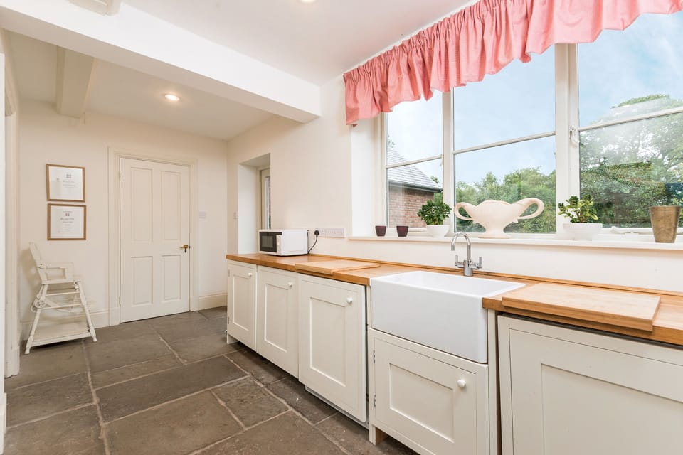 The laundry room at Monnington House with 2 washers and 1 dryer. 