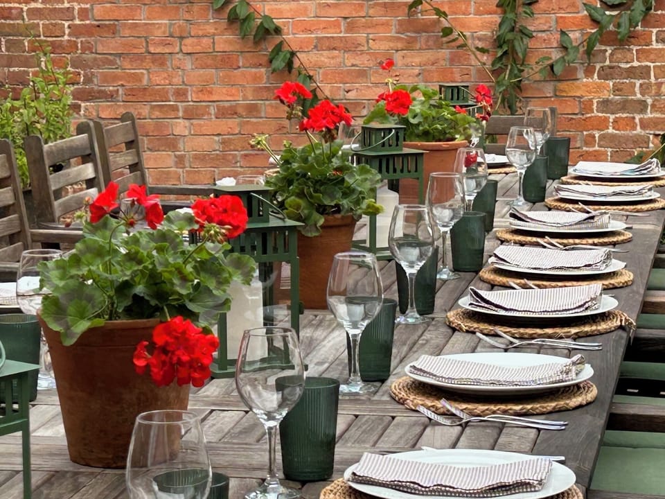 Fabulous outdoor eating area for up to 24 in sheltered spot next to the kitchen